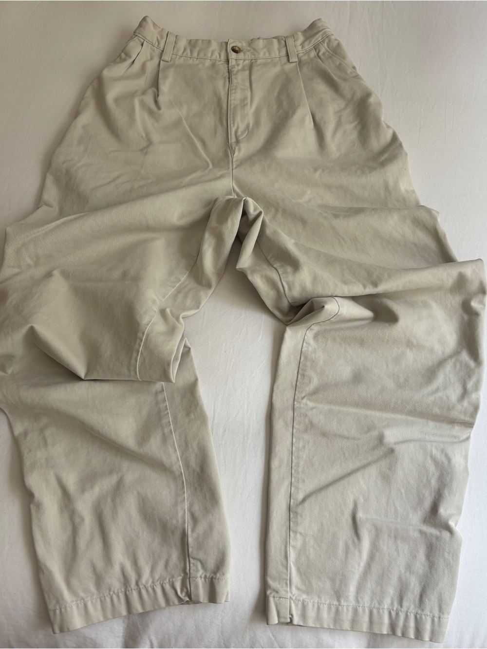 Vintage cream/khaki high-waisted pants with a relaxed fit and wide leg